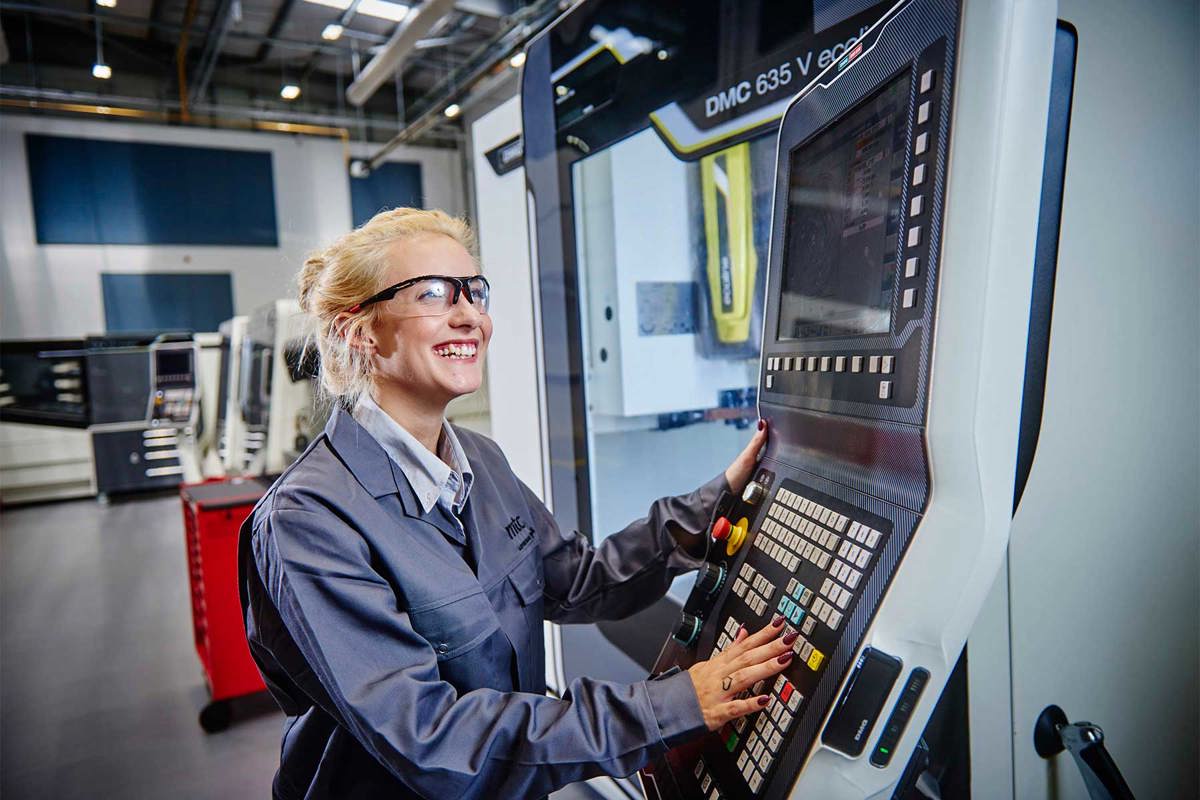 Apprentice operating a CNC machine at MTC Training