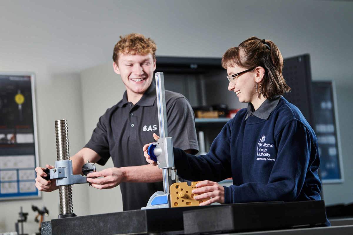 Engineering apprentices working at a bench in an MTC Training workshop
